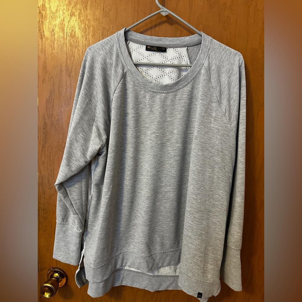 Long sleeve shirt with a sheer back